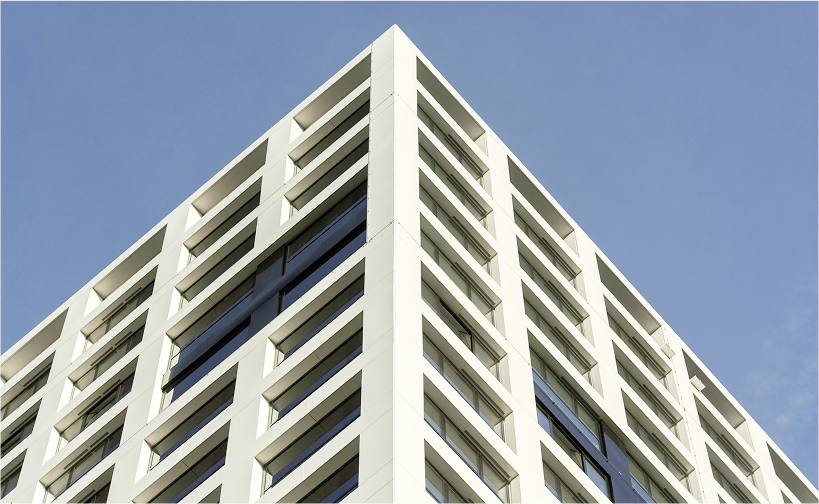 Corner view of a modern office building with glass windows